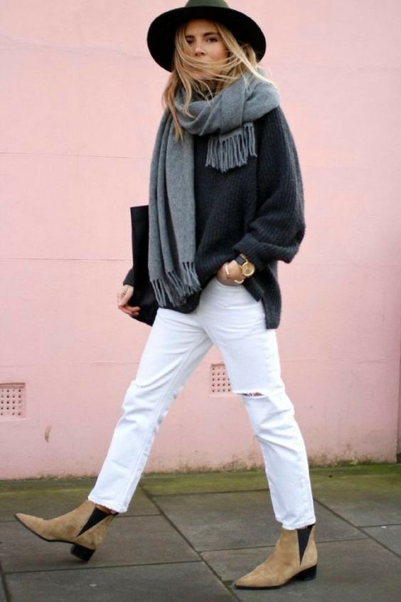 Blonde model styled in white pants and a scarf