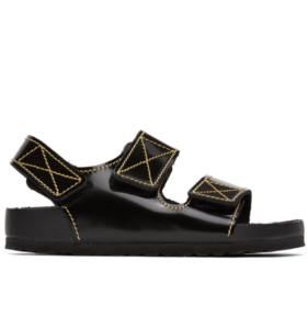 Black leather sandals with yellow Xs sewed on the straps