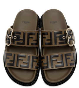 Brown double strap trendy Birkenstock sandals with one gold buckle