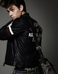 Stylish man showing off back of varsity jacket